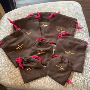 kate spade brown jewelry pouches with pink drawstrings (set) 5 large 3 small